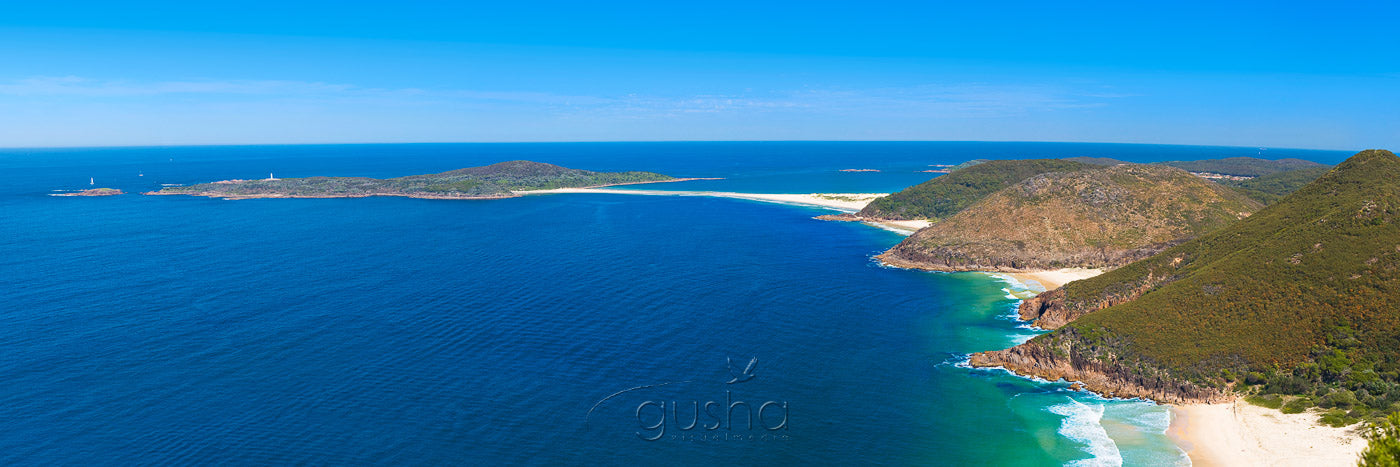Views from Tomaree Headland at Port Stephens. From bottom right, Zenith Beach, Wreck Beach, Box Beach, then Fingal Bay and Point Stephens can be seen in the distance.
