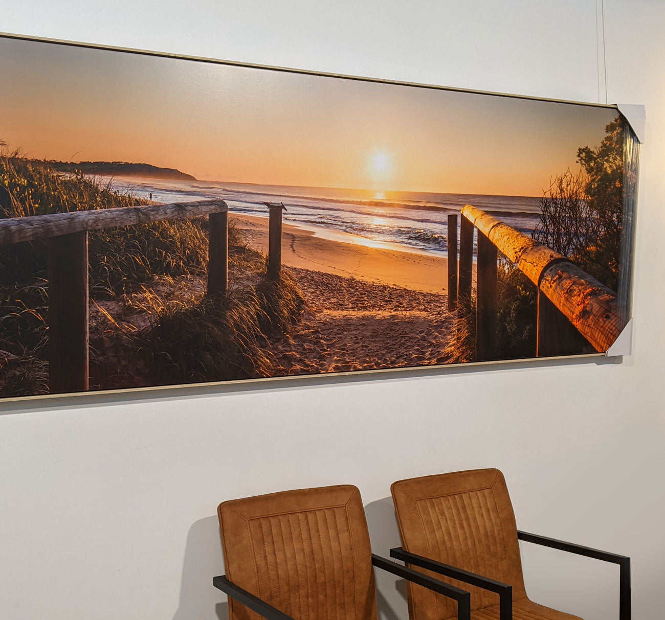 Large beach scene canvas print-on display in reception area