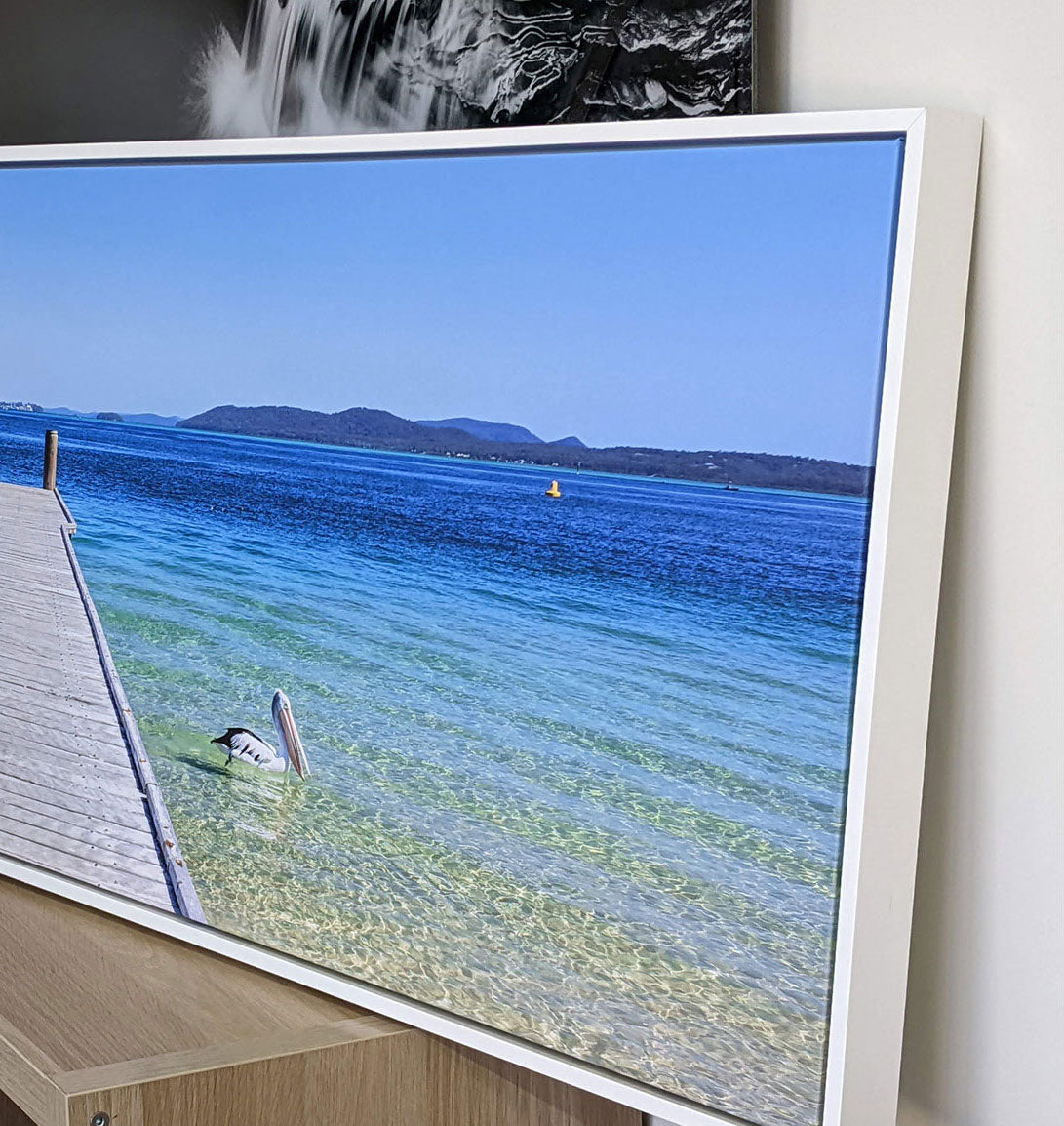 Seascape canvas print with white float frame