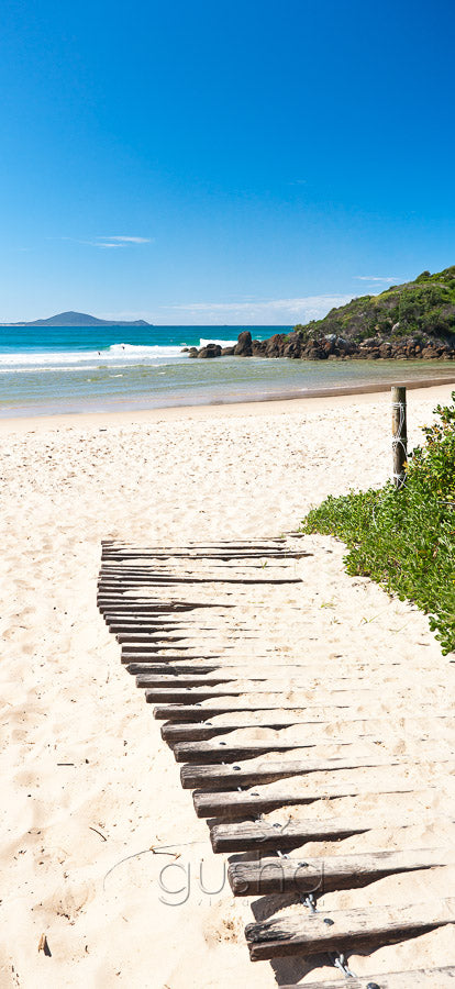 A rustic beach track points the way to Hat Head beach