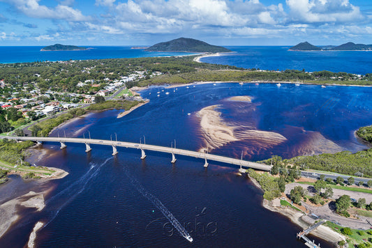 The Singing Bridge links Tea Gardens with Hawks Nest. Yacaaba Headland can also be seen at the centre of the horizon.