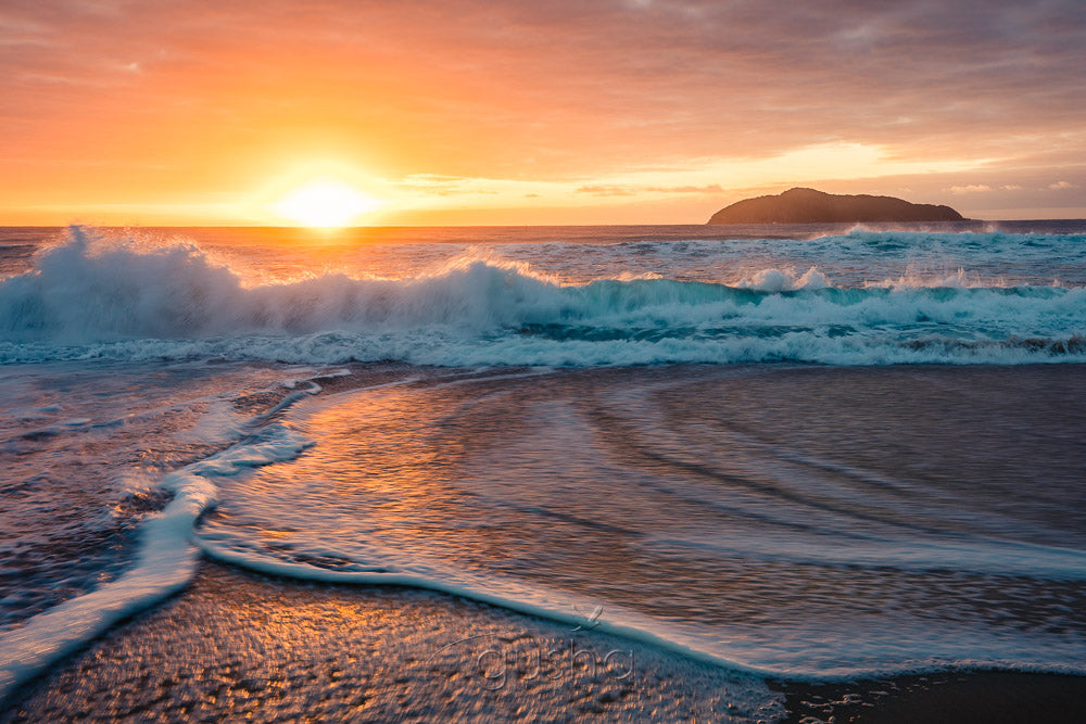 A photo that captures the energy of the ocean taken at sunrise on Bennetts Beach.