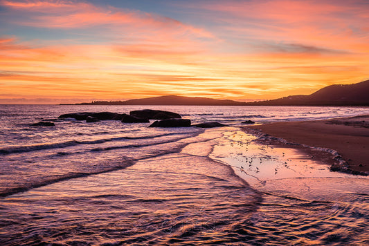 A big sunrise dominates the sky over Front Beach at South West Rocks.